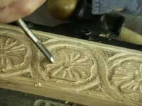 Hand carving gothic dogwood in ghilloche in progress view 2