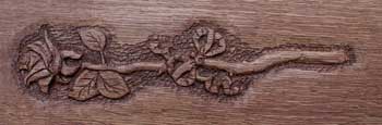Hand carved long stem rose on quarter sawn oak
