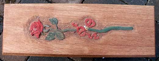 Hand carved long stem rose on quarter sawn oak Tinted