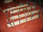 Hand Carved New Wave Gothic Entertainment Center by Artisans of the Valley - In Progress Legs In Clamps