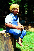 Artisans of the Valley feature Chainsaw Carving by Bob Eigenrauch - Fishing Boy sitting on Stump
