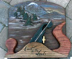Custom hand carved sign with Rocky Mountain Scene and a Scale Wood Plane